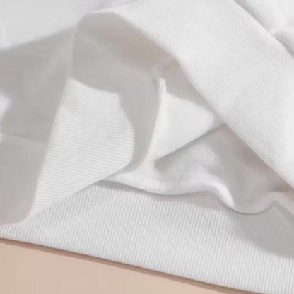 Close-up of white long sleeve shirt fabric and ribbed cuff