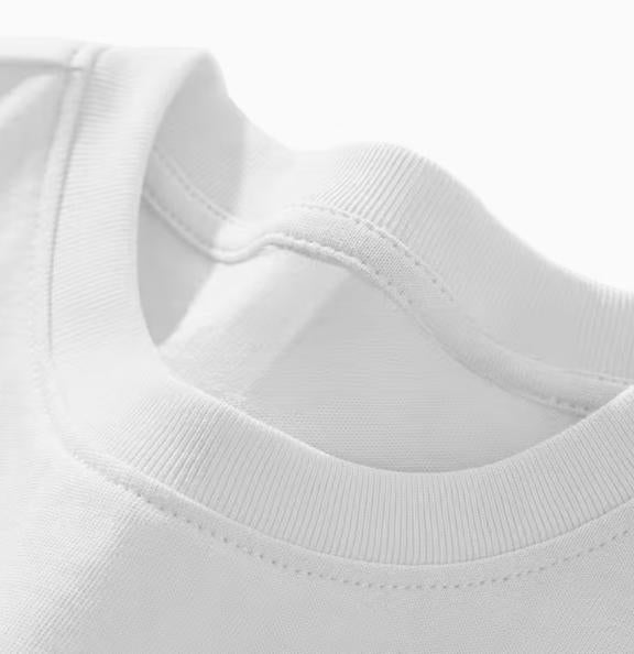 White long sleeve shirt ribbed crew neckline and stitching close-up
