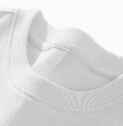 White long sleeve shirt ribbed crew neckline and stitching close-up