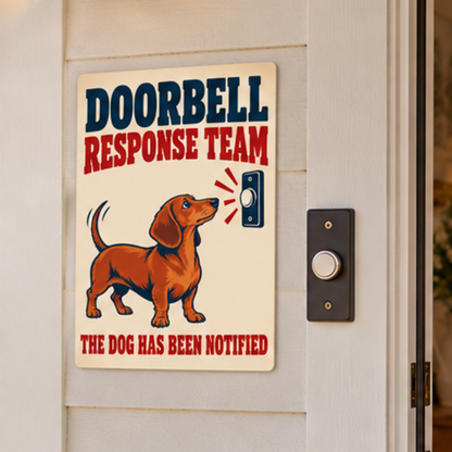 Dachshund Doorbell Response Team 8 x 12 inch metal sign mounted outside beside a doorbell, close view