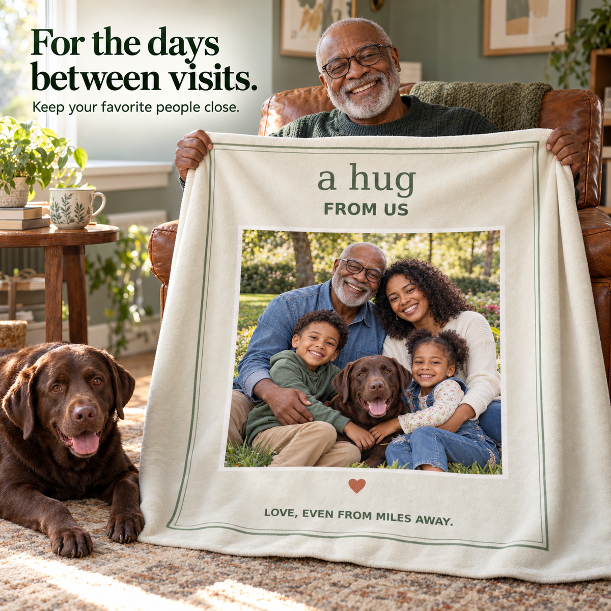 Grandfather in a reading chair with a family photo flannel blanket and a Labrador beside him; illustrative lifestyle mockup.
